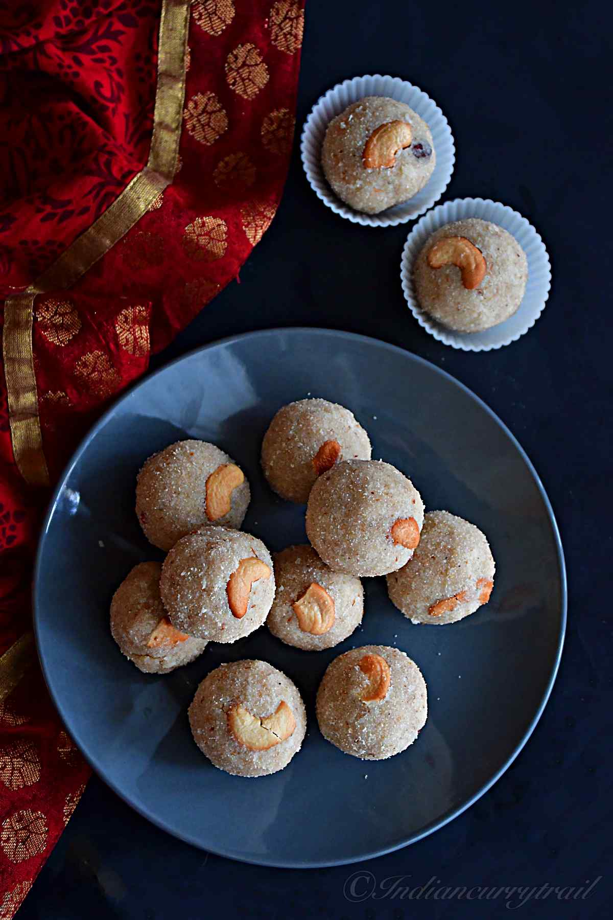 top view of rava laddus kept on a gray colored plate.